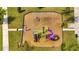 Overhead shot of a playground featuring a slide and swings at 368 Ocean Course Ave, Davenport, FL 33896