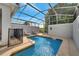 Sparkling pool with a screened-in enclosure, providing a private oasis for relaxation and recreation at 368 Ocean Course Ave, Davenport, FL 33896