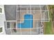 Aerial view of a screened pool with lounge chairs, providing a private outdoor relaxation space at 368 Ocean Course Ave, Davenport, FL 33896