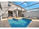 Inviting pool area with ample seating and a screened enclosure, ideal for enjoying the outdoors in comfort at 368 Ocean Course Ave, Davenport, FL 33896