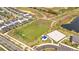 Aerial view of a community soccer field and sand volleyball court for residents at 368 Ocean Course Ave, Davenport, FL 33896