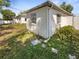 Well maintained backyard of the home with lawn and landscaping and view of the back of the house at 370 E Waldo St, Groveland, FL 34736