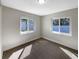 Clean and bright bedroom space with neutral walls and floors, offering a blank canvas for personalization at 370 E Waldo St, Groveland, FL 34736