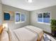 Cozy bedroom with natural light, neutral decor, and comfortable furnishings, perfect for relaxation at 370 E Waldo St, Groveland, FL 34736