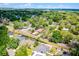 An aerial view shows the property nestled among mature trees in a quiet residential neighborhood at 3723 Broadway St, Gotha, FL 34734