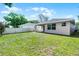 Spacious backyard with new construction home, new fence, and fresh green grass at 3723 Broadway St, Gotha, FL 34734