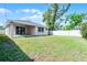 Large backyard with new construction home and freshly installed white fence at 3723 Broadway St, Gotha, FL 34734