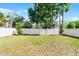 Spacious backyard with new white fence and mature trees at 3723 Broadway St, Gotha, FL 34734