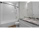 Bright bathroom features a white subway tile shower and granite vanity at 3723 Broadway St, Gotha, FL 34734