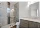 Modern bathroom features a glass enclosed shower, elegant vanity with stone countertop and stylish fixtures at 3723 Broadway St, Gotha, FL 34734