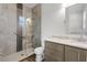 Bathroom features a glass enclosed tile shower and stone countertop vanity at 3723 Broadway St, Gotha, FL 34734