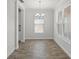 Bright and airy dining room with tile floors, a modern chandelier, and lots of natural light at 3723 Broadway St, Gotha, FL 34734