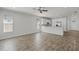 Open living area with tile floors, mini-split, and a view of the breakfast bar and the stainless steel appliances at 3723 Broadway St, Gotha, FL 34734