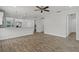 Bright open living area showcasing the modern breakfast bar and white kitchen with stainless appliances at 3723 Broadway St, Gotha, FL 34734