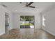 Bright living room with tile floors and sliding glass doors that open to the backyard, offering seamless indoor-outdoor living at 3723 Broadway St, Gotha, FL 34734
