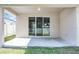 Covered patio has sliding glass doors and view to interior of home at 3723 Broadway St, Gotha, FL 34734
