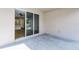 Covered patio has sliding glass doors and view to interior of home at 3723 Broadway St, Gotha, FL 34734
