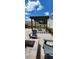 Backyard featuring a pergola, fire pit, Adirondack chairs, and paver patio at 402 Cool Summer Ln, Davenport, FL 33837