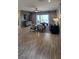 Comfortable living room with stylish accents, a flat-screen TV, and sliding glass doors at 402 Cool Summer Ln, Davenport, FL 33837