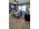 Inviting living room with modern decor, a ceiling fan, and a view of the outdoor patio at 402 Cool Summer Ln, Davenport, FL 33837