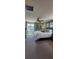 Spacious main bedroom with ceiling fan, large window, accent wall art, and neutral carpeting at 402 Cool Summer Ln, Davenport, FL 33837