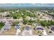 An aerial view of a neighborhood showcasing tree-lined streets and varied home styles at 432 Taylorville St, Deltona, FL 32725