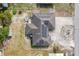 An overhead view of a home's roof with solar panels and a spacious backyard at 432 Taylorville St, Deltona, FL 32725