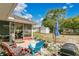 Spacious backyard features an outdoor seating area, grill, and shed, perfect for relaxation and entertainment at 432 Taylorville St, Deltona, FL 32725