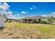 The yard features a screened patio and ample space for gardening and recreation at 432 Taylorville St, Deltona, FL 32725