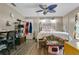 Bedroom with a four-poster bed, ceiling fan, and unique decor, offering a comfortable and personalized space at 432 Taylorville St, Deltona, FL 32725