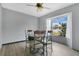 Cozy dining area features a round table, ornate chairs, and a bay window providing natural light and a view at 432 Taylorville St, Deltona, FL 32725