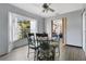 Cozy dining area features a round table, ornate chairs, and a bay window providing natural light at 432 Taylorville St, Deltona, FL 32725