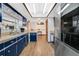 The kitchen features retro blue cabinetry and stainless-steel appliances at 432 Taylorville St, Deltona, FL 32725