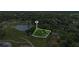 Stunning aerial view highlights the home's location near a picturesque lake and lush green spaces, ideal for nature lovers at 450 Andrews Dr, Longwood, FL 32750