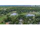A high angle showcases a neighborhood surrounded by lush greenery, ponds, and serene natural beauty at 450 Andrews Dr, Longwood, FL 32750