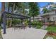 Back patio with pergola and dining set offering a perfect area for outdoor relaxation and dining at 450 Andrews Dr, Longwood, FL 32750