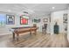 Entertaining basement featuring a pool table, bar stools, and a decorative brick wall at 450 Andrews Dr, Longwood, FL 32750