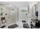 Updated bathroom boasting a glass-enclosed shower, dual sinks, and marble flooring at 450 Andrews Dr, Longwood, FL 32750
