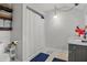 Bathroom featuring a shower with curtain, ceramic tile and an accent of dark blue mats at 450 Andrews Dr, Longwood, FL 32750