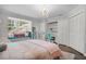 Charming bedroom with a window seat, chandelier and wood laminate flooring at 450 Andrews Dr, Longwood, FL 32750