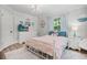 Charming bedroom with a TV, nautical decor, and wood laminate flooring at 450 Andrews Dr, Longwood, FL 32750