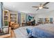 Comfortable bedroom featuring a study area, bookshelves, and a relaxing atmosphere at 450 Andrews Dr, Longwood, FL 32750