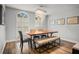 Dining room with large arched window and chandelier at 450 Andrews Dr, Longwood, FL 32750