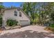 Exterior view of a two-story home with a brick driveway and a well-maintained yard at 450 Andrews Dr, Longwood, FL 32750