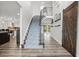 Elegant foyer with hardwood floors, a curved staircase, and a sliding barn door at 450 Andrews Dr, Longwood, FL 32750