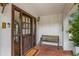 Charming front porch with bench seating and a 'Welcome' doormat at 450 Andrews Dr, Longwood, FL 32750