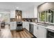Well lit kitchen featuring stainless steel appliances and views to the dining area at 450 Andrews Dr, Longwood, FL 32750