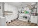Well-organized laundry room with white cabinets, shelving, and a utility sink, offering ample storage and convenience at 450 Andrews Dr, Longwood, FL 32750