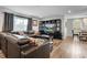Living room featuring a large window and an adjacent dining area at 450 Andrews Dr, Longwood, FL 32750