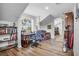 Bright office space with wood floors, built in bookcase and desk, offering a functional and stylish workspace at 450 Andrews Dr, Longwood, FL 32750